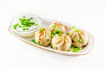 Georgian dumplings Khinkali with meat and green onion