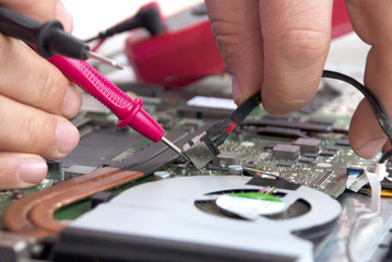 Laptop repair. / Broken computer repair with the instrument.Laptop Disassembling