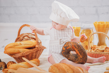 baby chef with bread and pasta