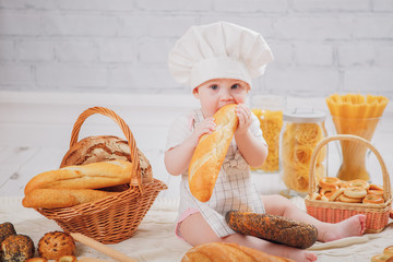 baby chef with bread and pasta