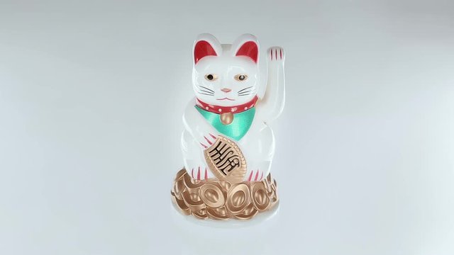 japanese beckoning cat isolated on white background