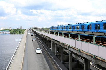 Modern bridge with subway train