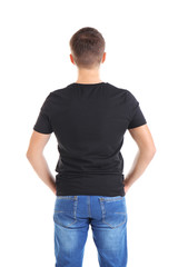 Fototapeta premium Handsome young man in blank black t-shirt on white background