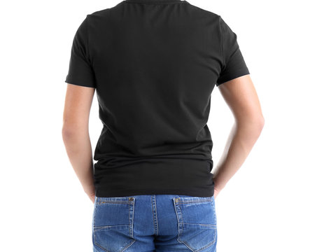 Handsome young man in blank black t-shirt on white background, close up