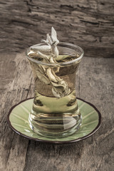 sage tea on wooden table