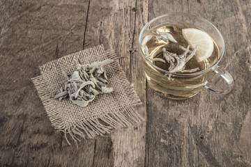 sage tea on wooden table