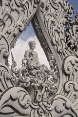 Wat Rong Khun, perhaps better known to foreigners as the White Temple Buddhist temple in Chiang Rai Province, Thailand.