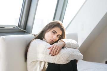 Woman sitting relaxed in bed