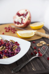 salad of red cabbage, pomegranate, apple and walnuts