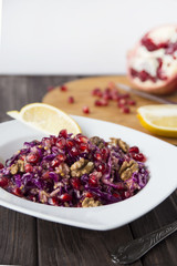 salad of red cabbage, pomegranate, apple and walnuts