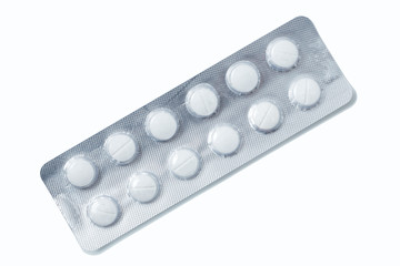 Aluminium blister pack of pills. The capsules are packaged in blisters, isolated on a white background. Disease. Flu. Medications.