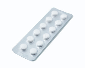 Aluminium blister pack of pills. The capsules are packaged in blisters, isolated on a white background. Disease. Flu. Medications.