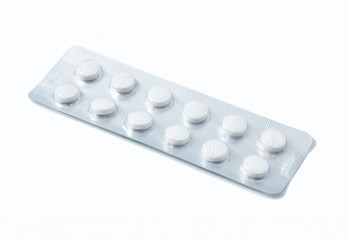 Aluminium blister pack of pills. The capsules are packaged in blisters, isolated on a white background. Disease. Flu. Medications.