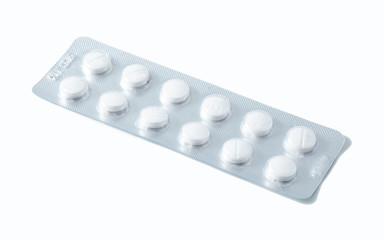 Aluminium blister pack of pills. The capsules are packaged in blisters, isolated on a white background. Disease. Flu. Medications.