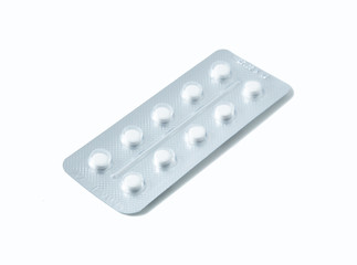 Aluminium blister pack of pills. The capsules are packaged in blisters, isolated on a white background. Disease. Flu. Medications.