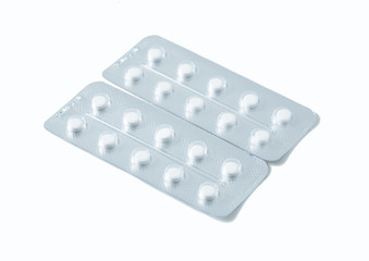 Aluminium blister pack of pills. The capsules are packaged in blisters, isolated on a white background. Disease. Flu. Medications.
