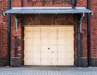 steel Door in a red brick wall