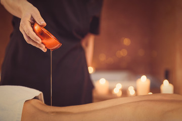 Skillful beautician preparing client for massage © Yakobchuk Olena
