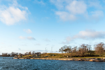 Naklejka premium Walkway on the waterfront with some clouds in the sky