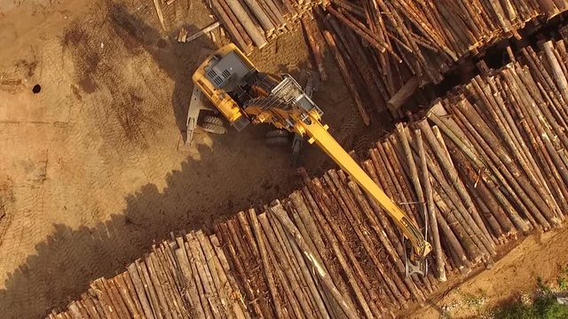 Woodworking plant. Loading logs. quadrocopter