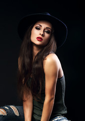 Beautiful cool female model with long brown hair and bright make
