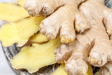 Fresh sliced ginger - ingredient for healthy food