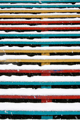 colorful stairs covered with snow. Winter snowfall