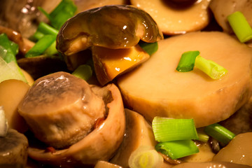 marinated mushrooms 
boletus background with fresh onions