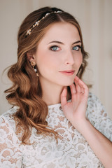 Fototapeta premium fashion studio photo of beautiful elegant bride with dark hair in luxurious wedding dress with headband