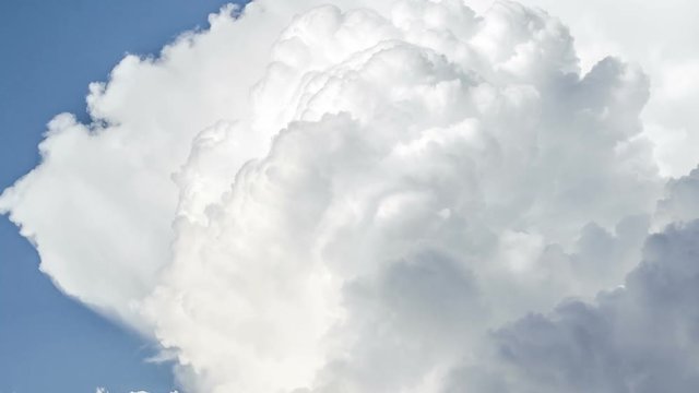 White stormy clouds towering over blue sky time lapse close up. 3 in 1 sequence