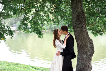 happy bride and groom at a park on their wedding day