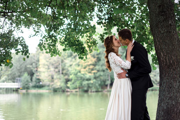 happy bride and groom at a park on their wedding day