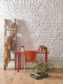 white brick wall chair and table decoration concept