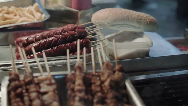 Greek souvlaki cart grill,local delicacies,street food.100 fps slow motion gimbal tracking shot of a greek souvlaki and sandwitch stand at night in an open area