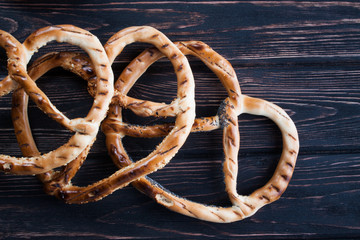 Fresh pretzels on wood desk