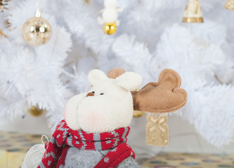 White Christmas tree, gold toys and deer