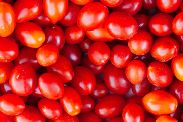 Close-up of a bunch of red cherry tomatoes in a greengrocer's sh