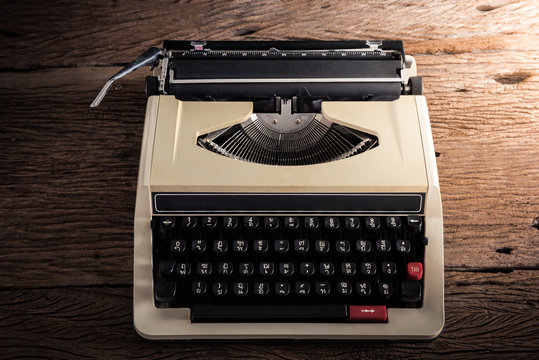 Vintage typewriter on wooden table