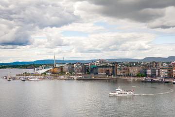 Boats in the canal, Aker Brygge district, in Oslo, Norway 