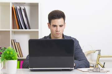 man in house or office with the computer laptop