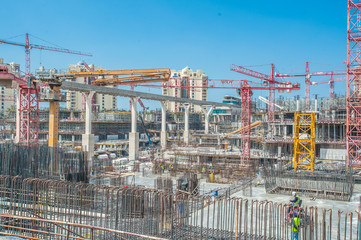 DUBAI - MARCH 03: builder sits on scaffolding, road construction in Dubai, Palm Jumeirah Dubai ...