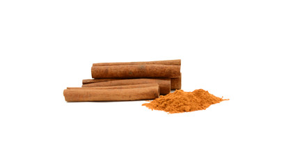 Cinnamon sticks with powder on white background
