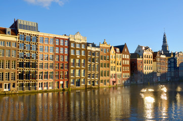 Fototapeta na wymiar View of Amsterdam with houses built on canals 