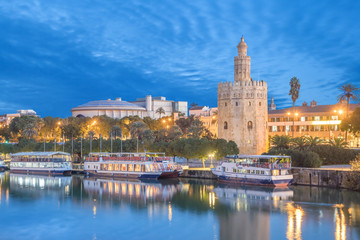 Illuminated Torre del Oro (Golden tower) in Seville, Andalusia, Spaim
