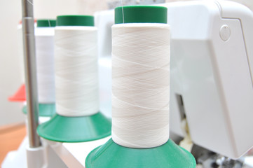 the coil is a spool of white thread for sewing