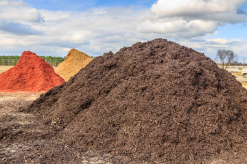Black Mulch or Wood Chip Mound
Mound of black mulch or wood chips use for landscaping top ground material and accents.