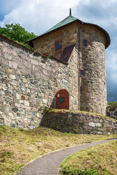 Oslo, Norway - July 18, 2016: Exterior of Akershus Fortress in Oslo, Norway. Akershus Fortress or Akershus Castle is a medieval castle that was built to protect Oslo, the capital of Norway. 