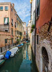 Obraz na płótnie Canvas A view of old buildings against blue sky in Venice,Italy