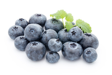 Close up of a blueberry branch isolated over white.