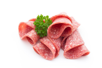 Salami sausage slices isolated on white background.